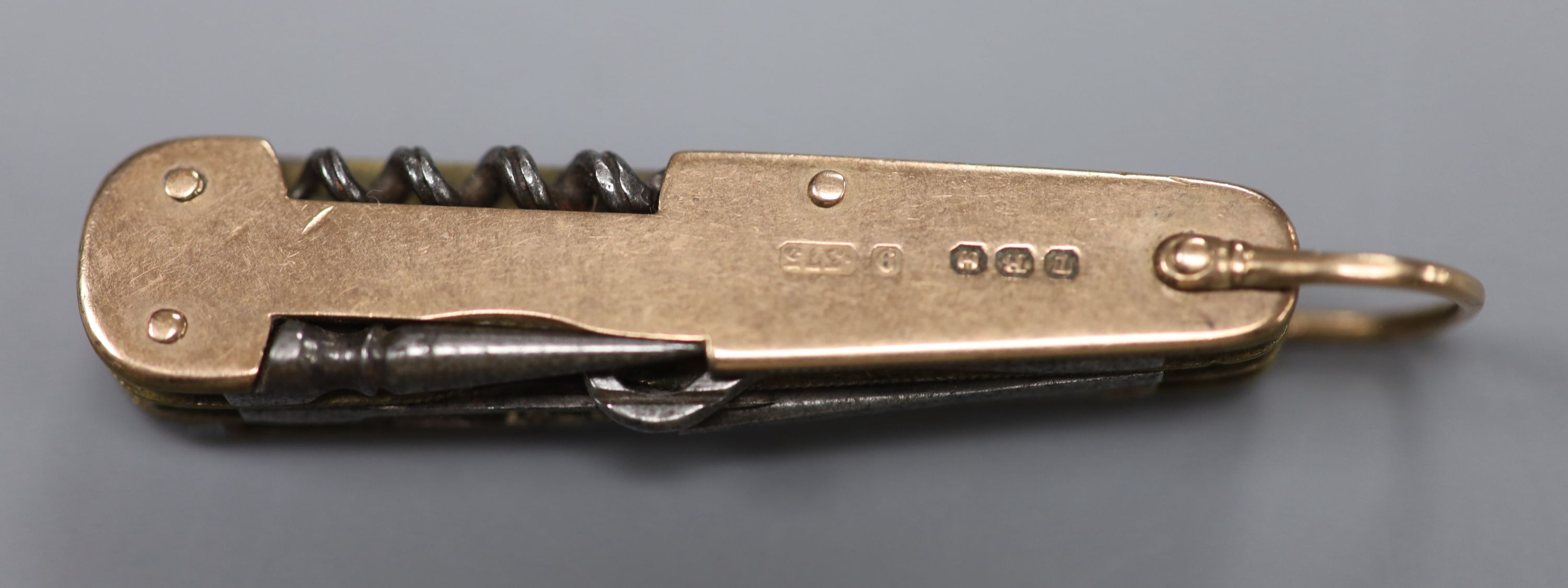 A late Victorian 9ct gold mounted multi-tooled pocket knife, maker T.B.H, Birmingham, 1900,